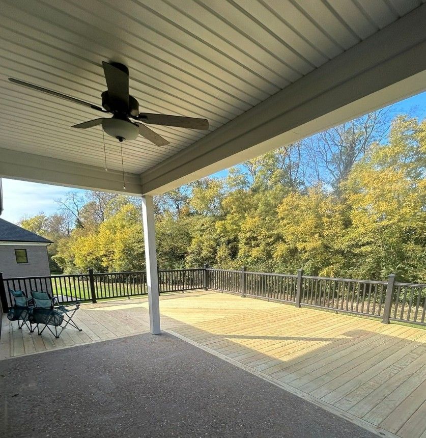 Outdoor living space featuring cedar deck and privacy screen