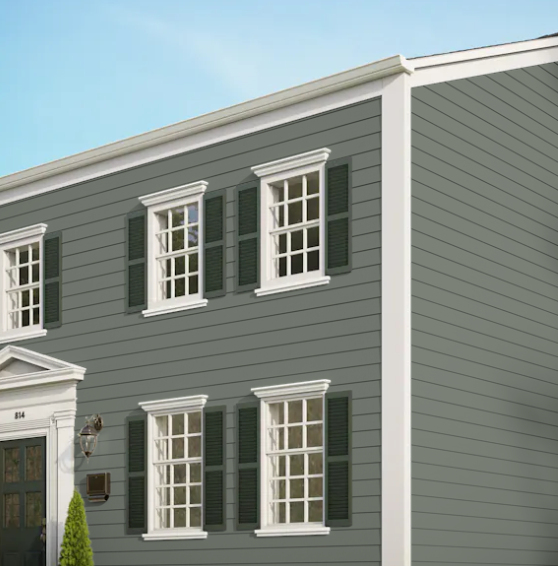 A gray house with white trim and black shutters
