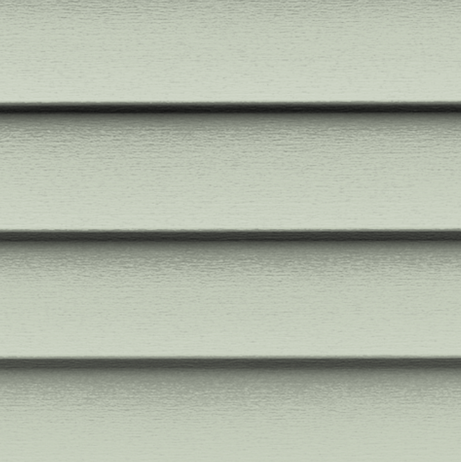 A close up of a green siding on a house.