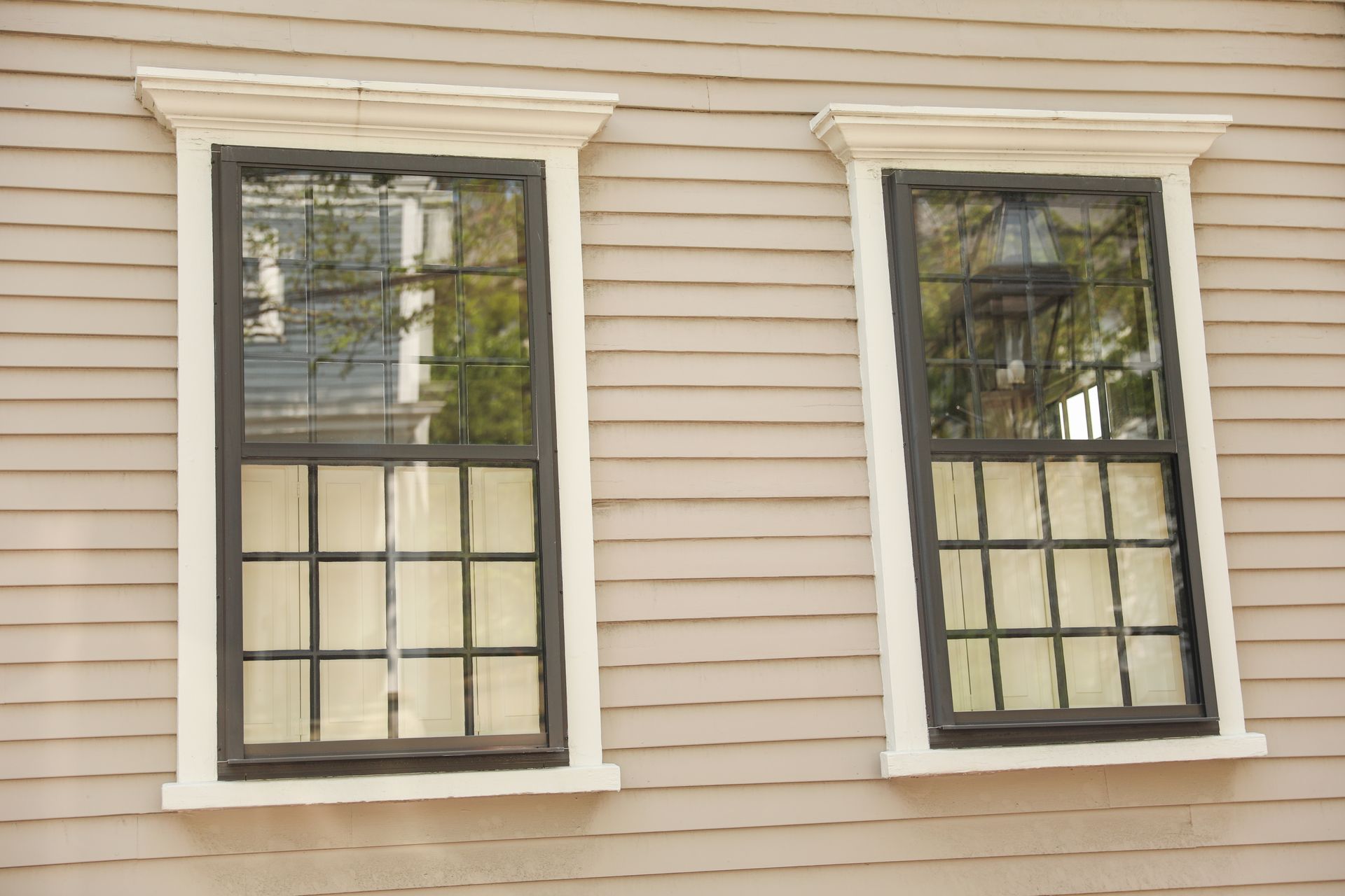 Denver window contractor explaining energy-efficient window options to homeowner
