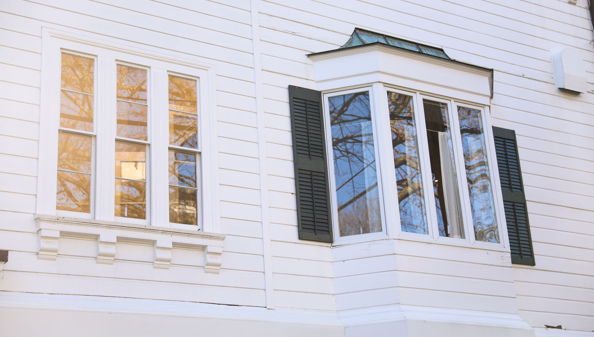 Denver window contractor explaining energy-efficient window options to homeowner
