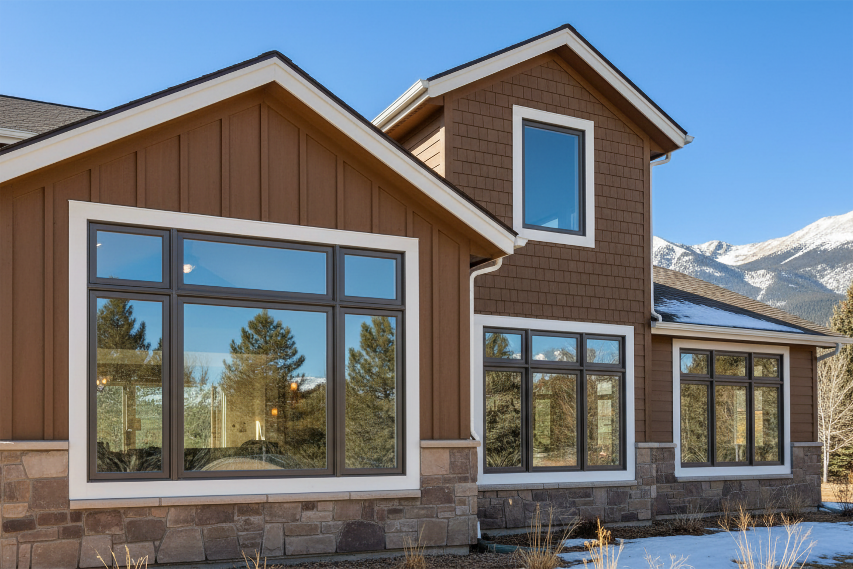 Colorado home new double-pane replacement windows and mountain backdrop showing energy efficiency