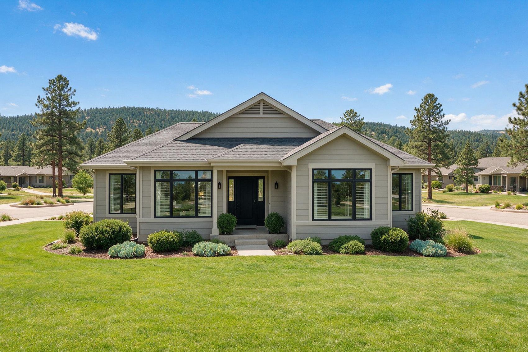 Colorado foothills home with black-framed windows and cleared defensible space around the property