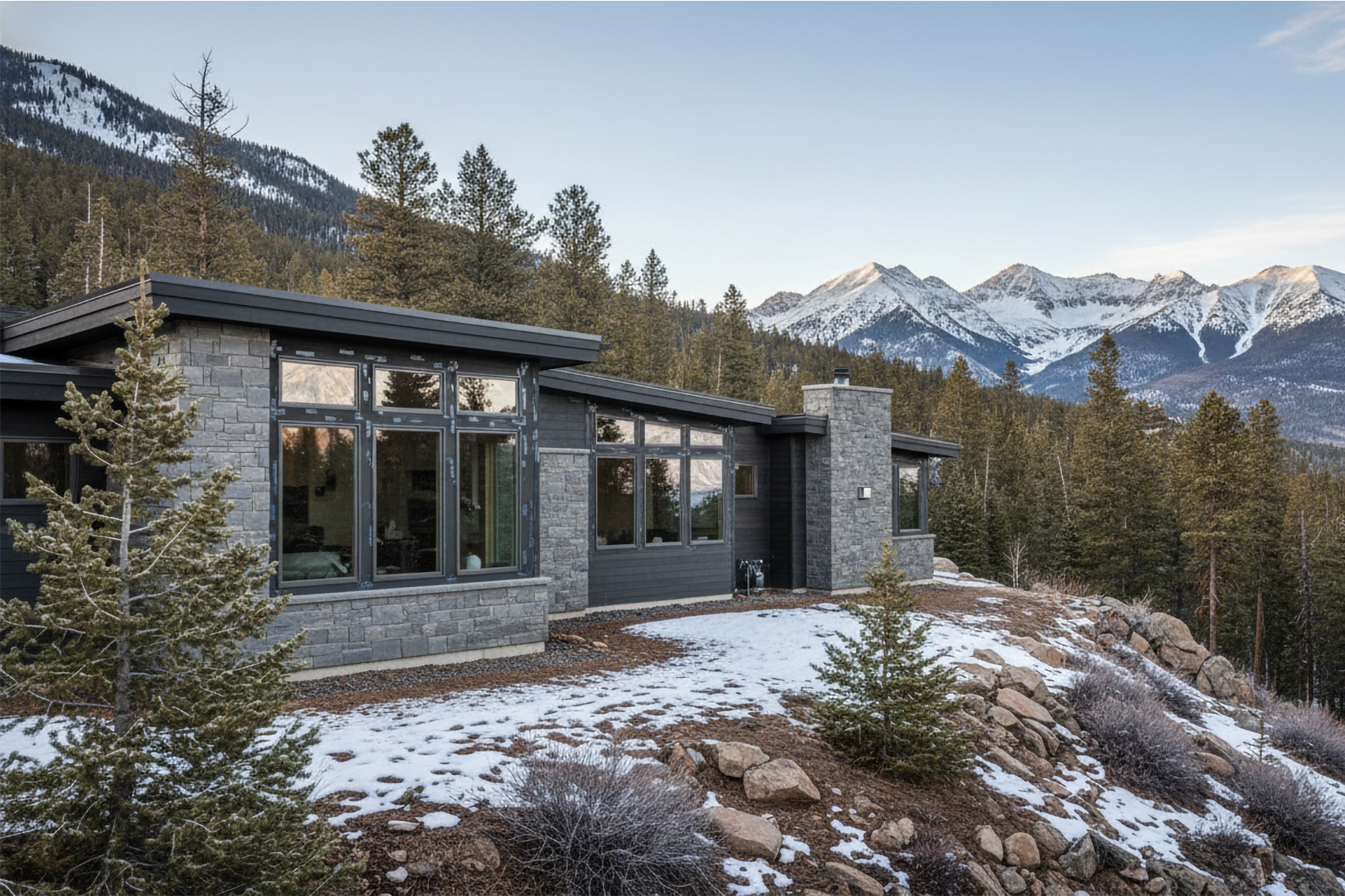 Colorado mountain home with replacement windows surrounded by snow and pine trees