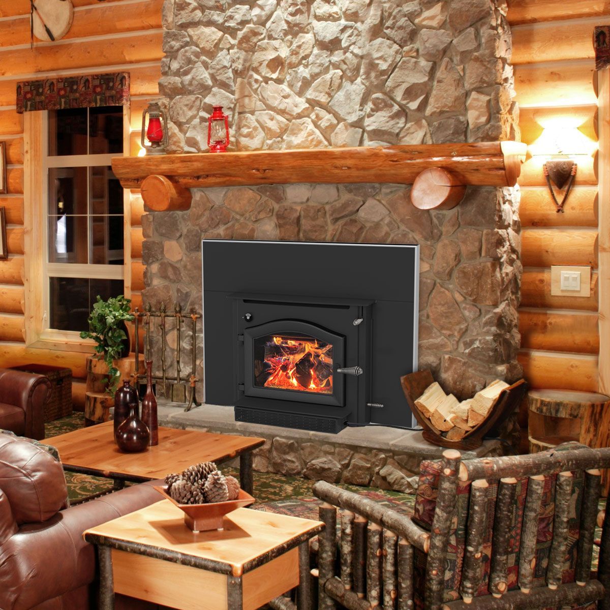 A living room with a fireplace surrounded by logs