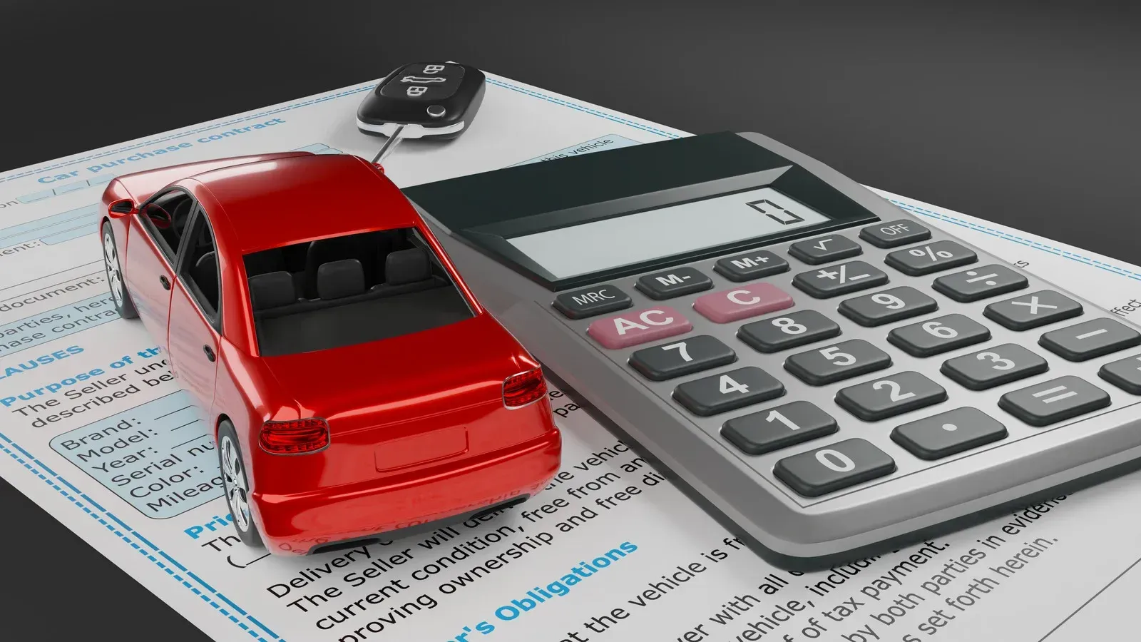 A red car is sitting on top of a calculator on a piece of paper.