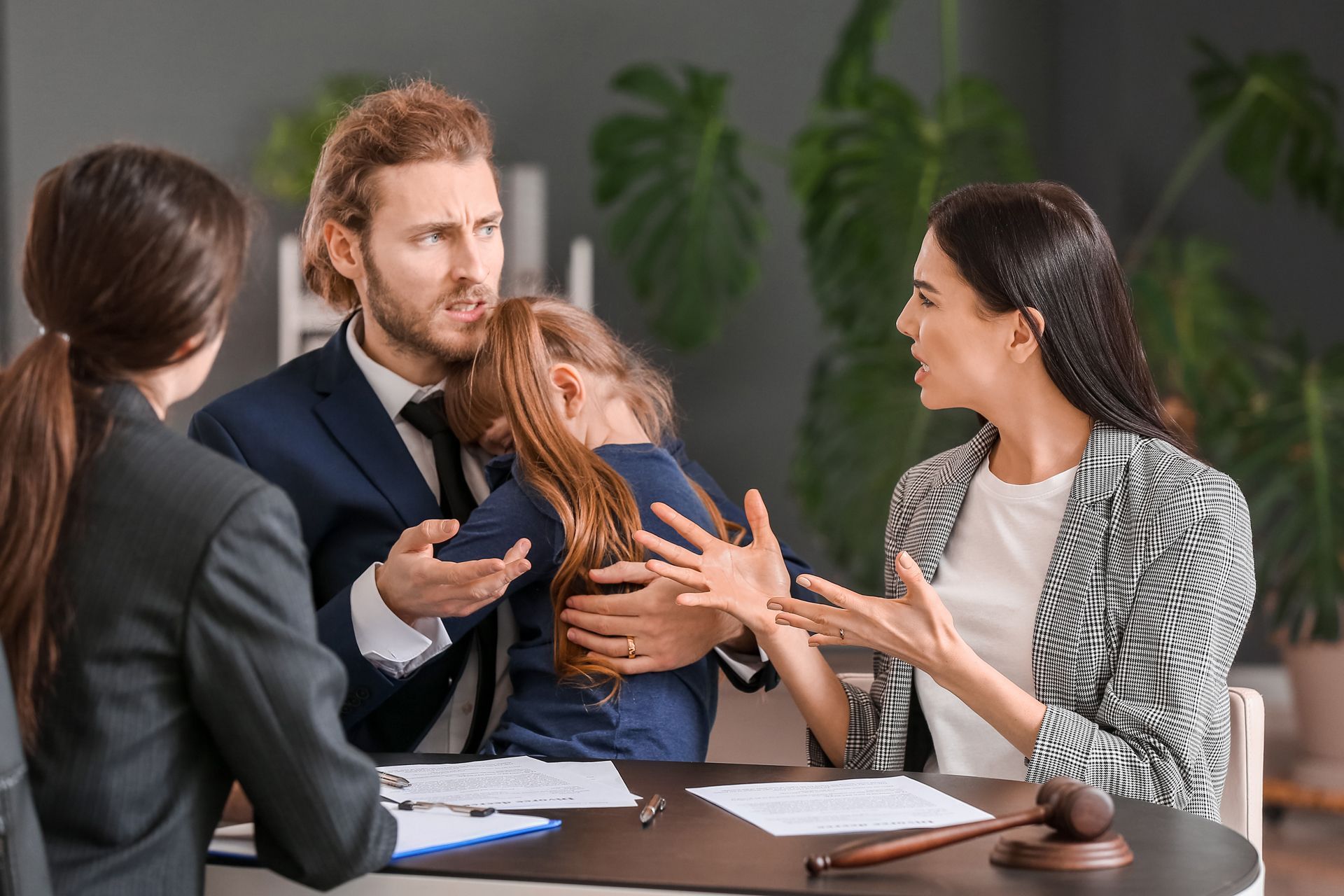 Family and lawyers in office.