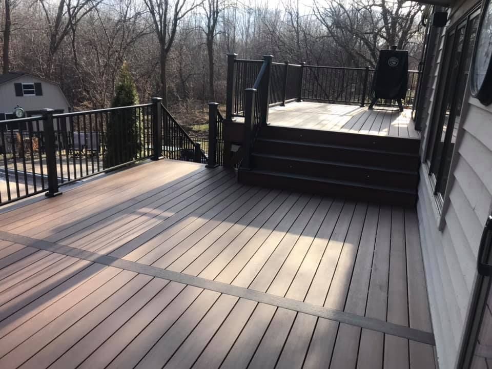 A wooden deck with stairs leading up to it