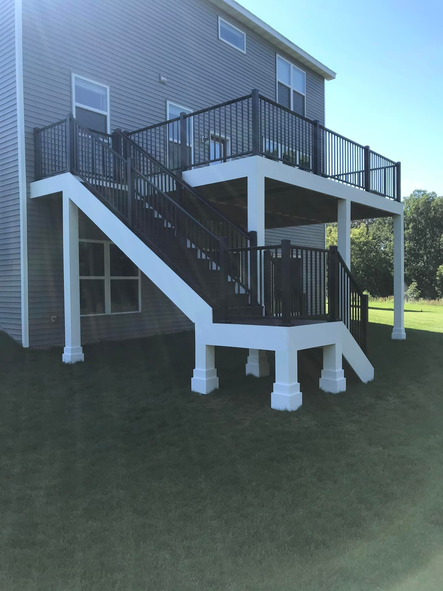 A large deck with stairs leading up to it