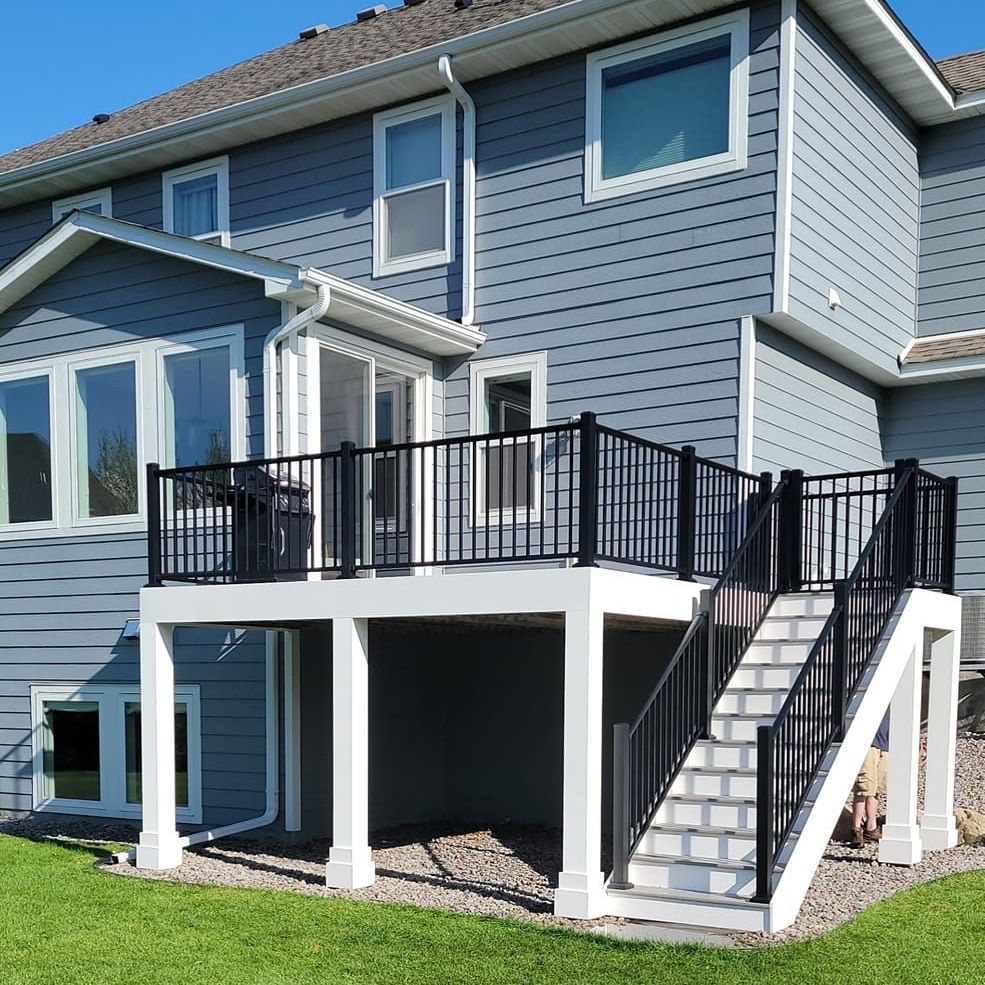 The back of a house with a deck and stairs