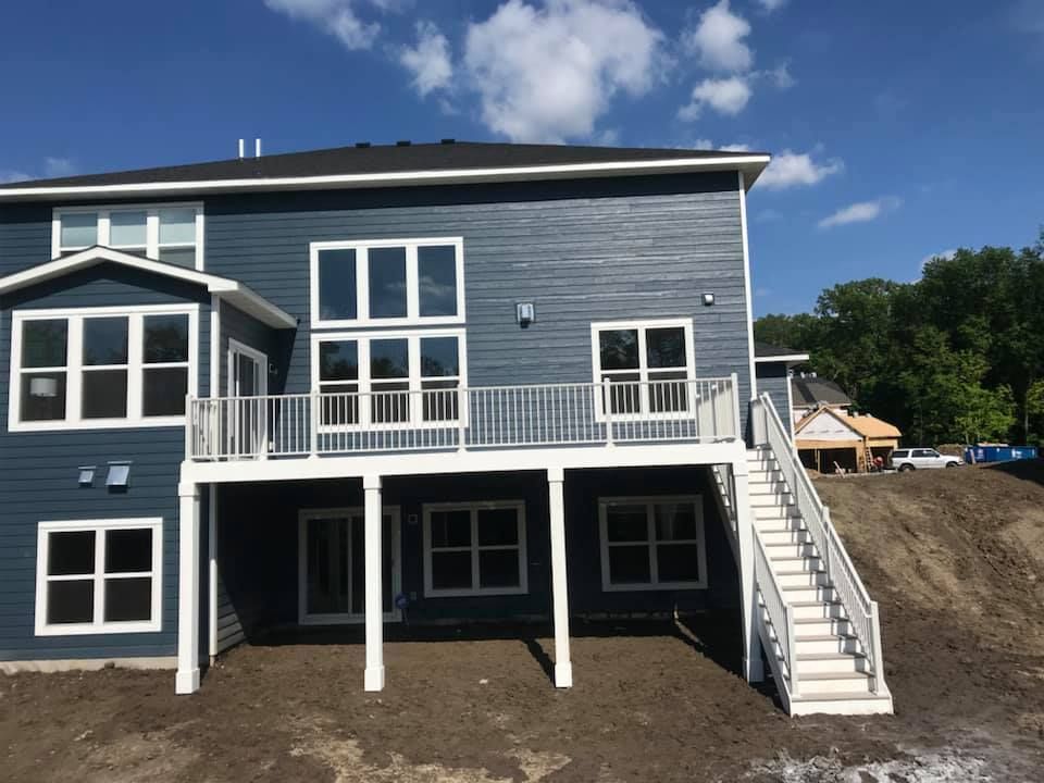 The back of a house with stairs leading up to it