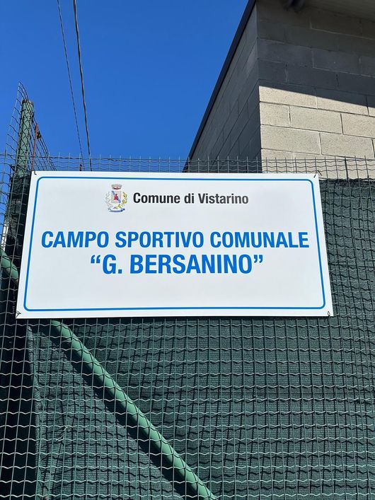 Sign for Campo Sportivo Comunale “G. Bersanino” in Vistarino against blue sky