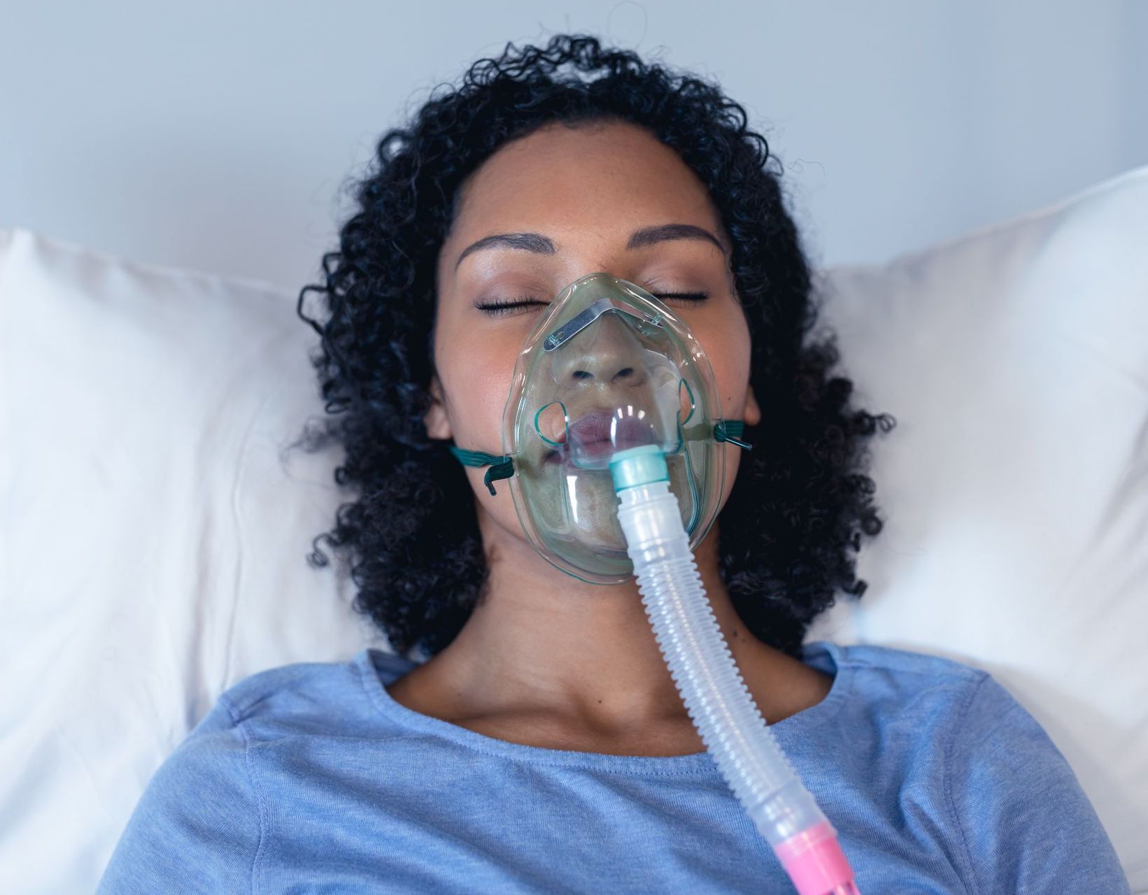 woman with sleep apnea mask on | lynnwood WA best family dentist 