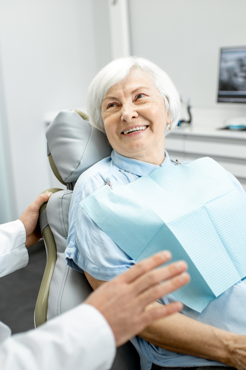 old woman smiling at dentist | Get smile in a day makeovers in Lynnwood WA 98036 | Dental Implants