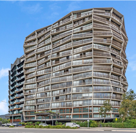 A large building with a lot of windows and balconies