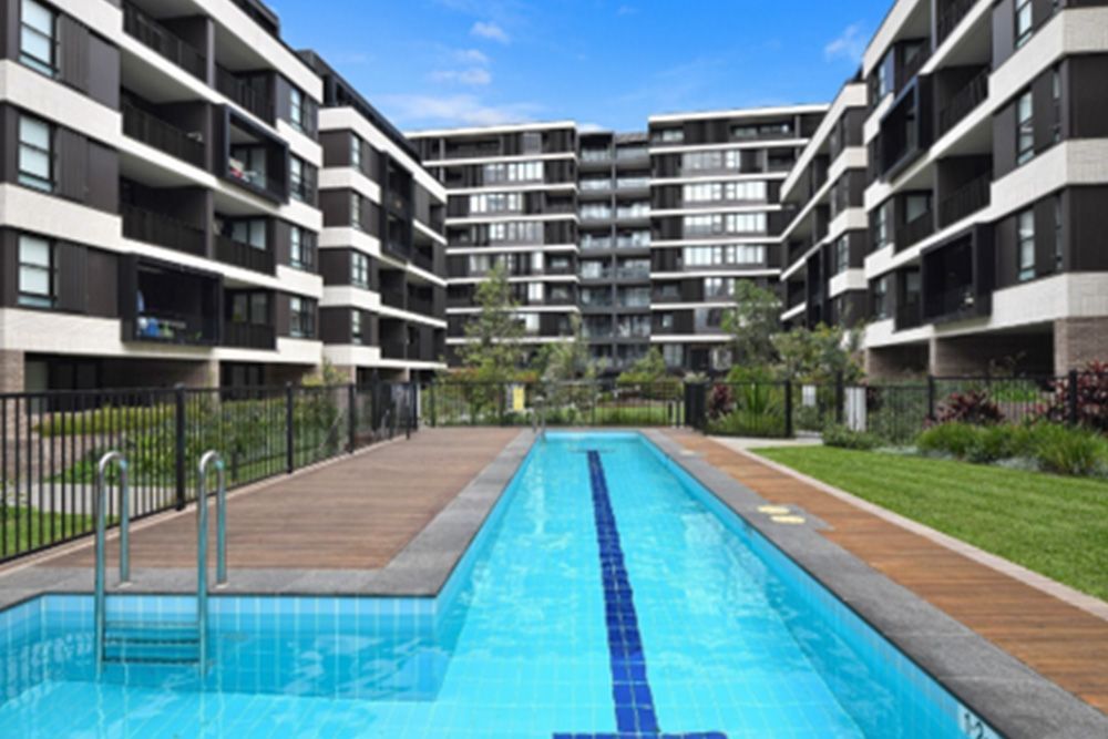A large swimming pool in the middle of a building.