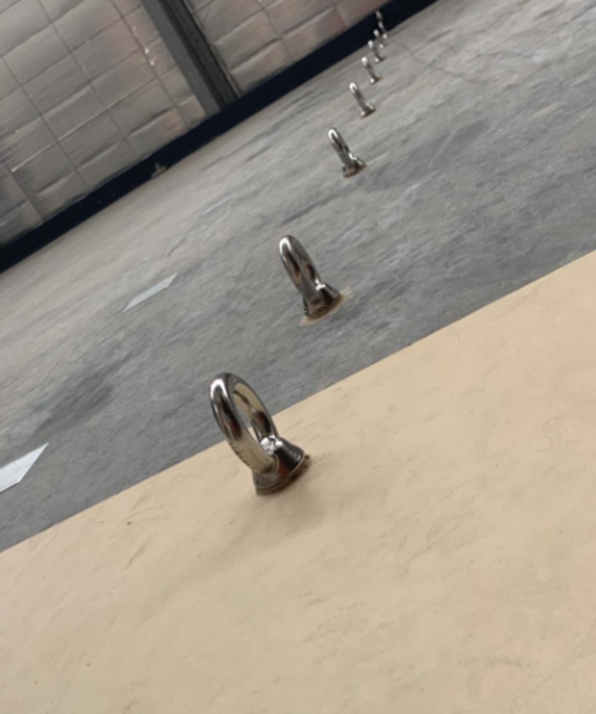 A row of metal objects are sitting on a table