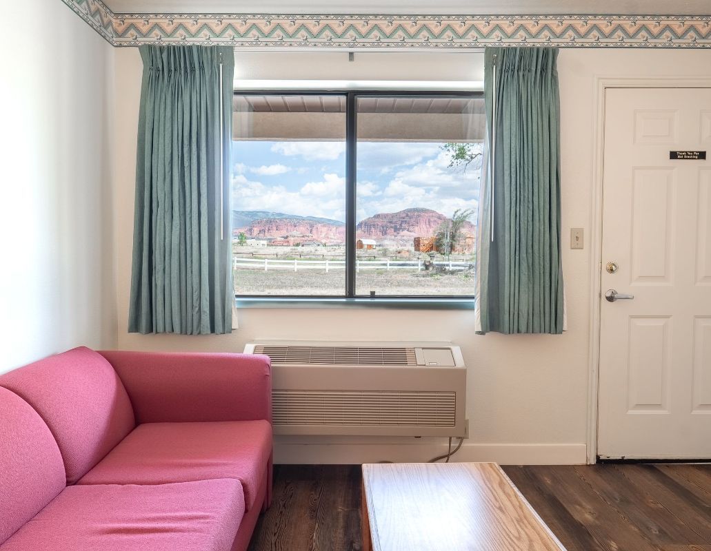 beautiful red rocks visible through motel room window