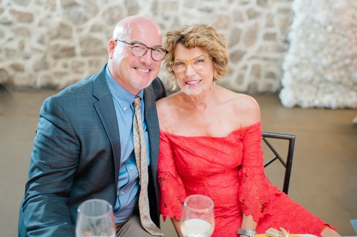 Mike & Heather Jackman |Distinguished, well-dressed couple in a warm refined setting