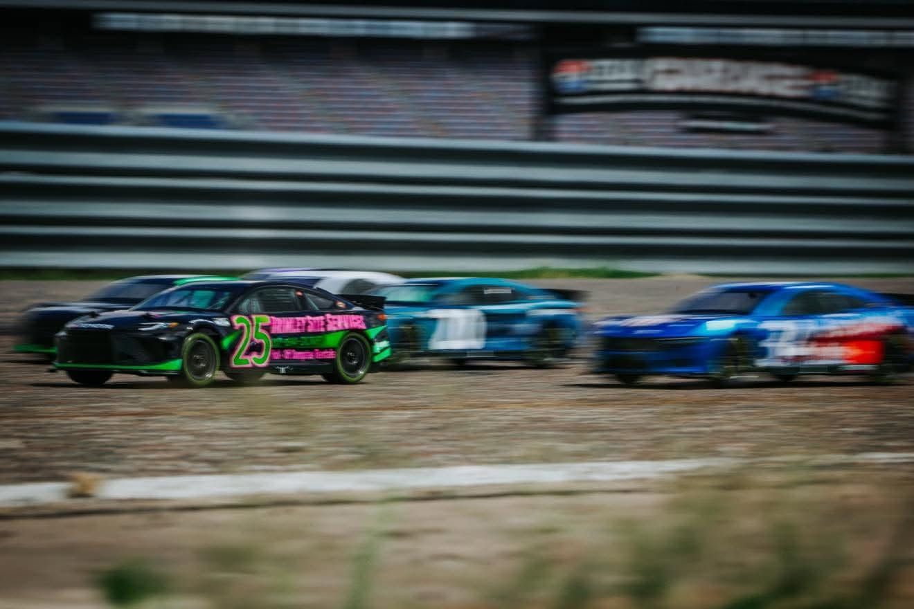 Hobby-grade Losi RC NASCAR car in brand colors on track