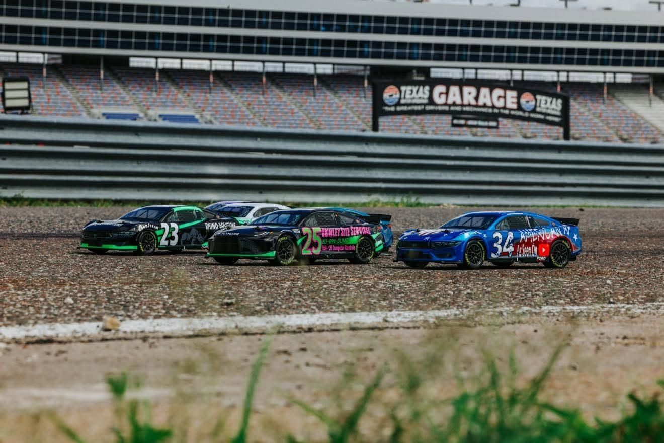 Custom branded RC NASCAR cars lined up on the track