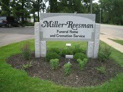 Miller-Reesman Funeral Home and Cremation Service sign in a landscaped outdoor setting