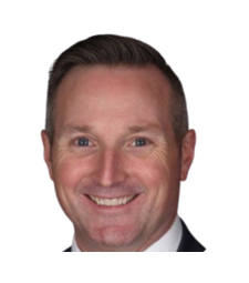 Smiling man in a dark suit jacket, headshot on a white background