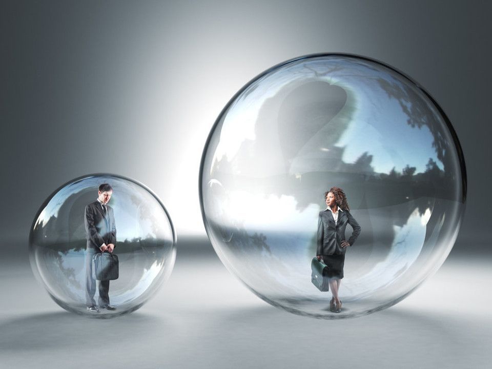 Woman in a black jacket standing in a reflective glass sphere with a cloudy sky backdrop