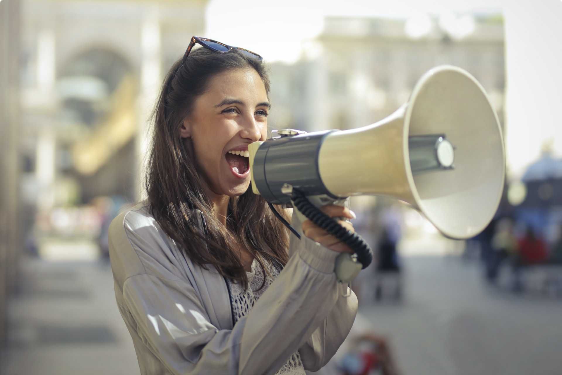 A woman is shouting into a megaphone