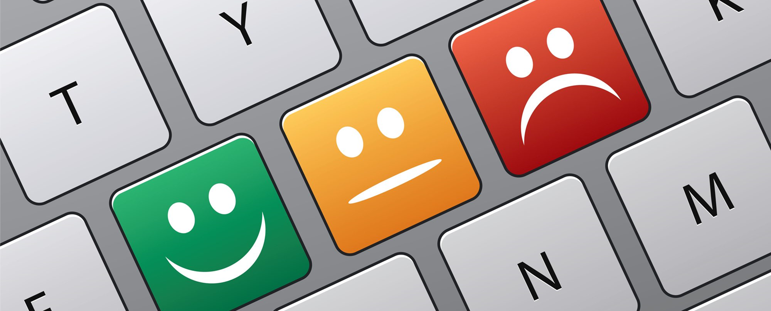 A set of three keys showing the emotions happy, neutral, and sad