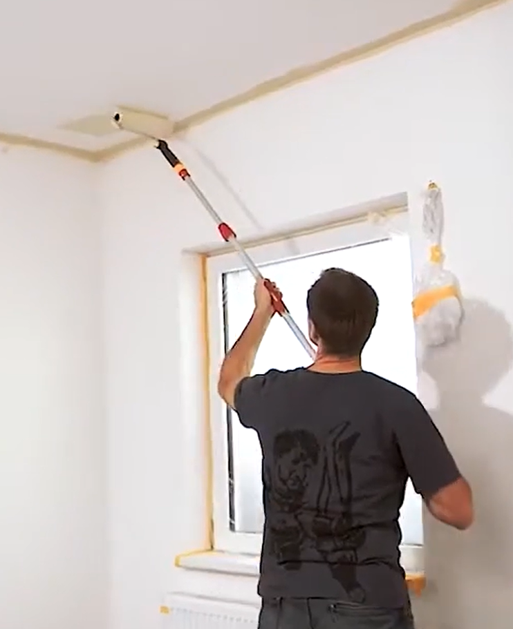 construction worker doing an interior paint job