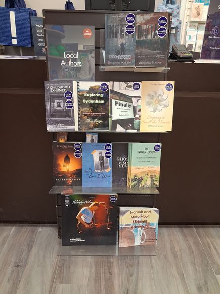 Susan McElroy books on display in Coles