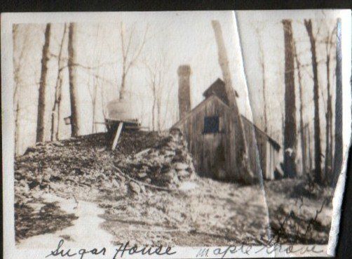 Historic sugarhouse at Isham Family Farm in Vermont, shown in the early 1900s during maple sugaring season.