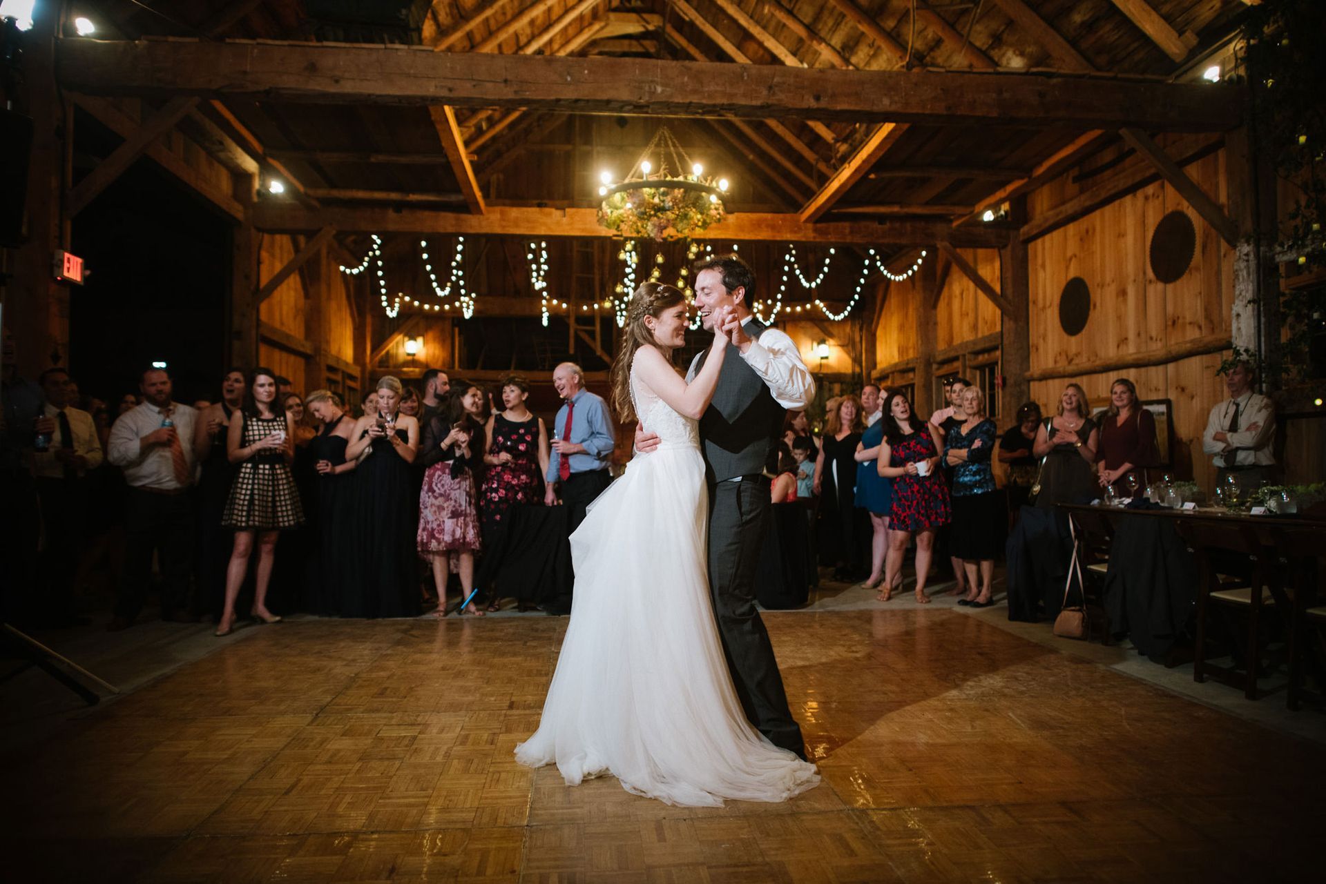 newlywed couple first dance in our barn after isham family farm wedding ceremony. tips for planning a vermont wedding
