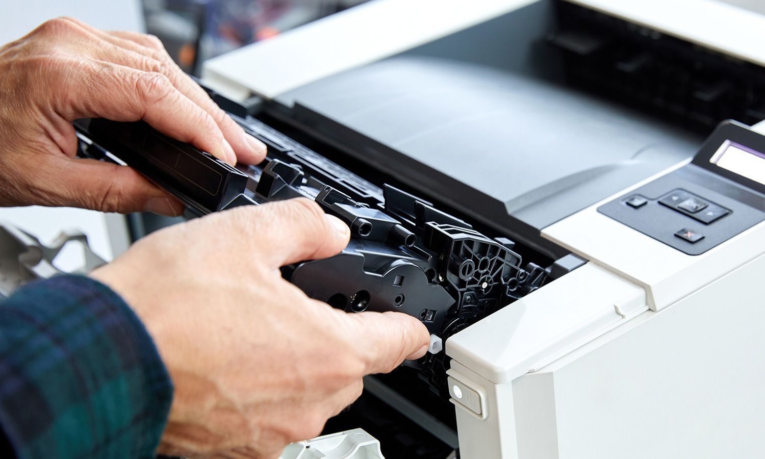 A Person is Fixing a Printer — Lancaster, PA — Knight's Copier Sales & Service