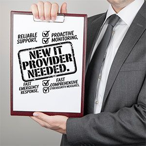 Man in suit holding a clipboard with 