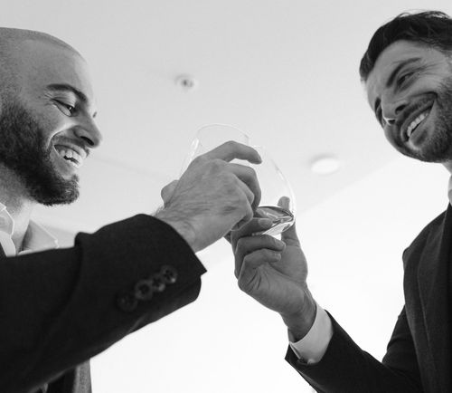 Anthony Carpinelli of RJC Hospitality, a Tampa restaurant consultant, raising a glass with a colleague