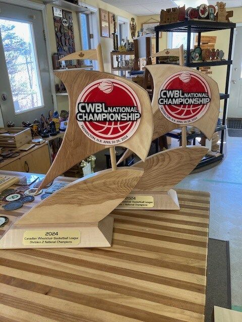 A wooden boat shaped trophy for the cwbl national championship