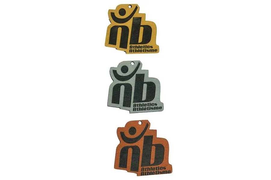 Three different colored air fresheners with the letter nb on them