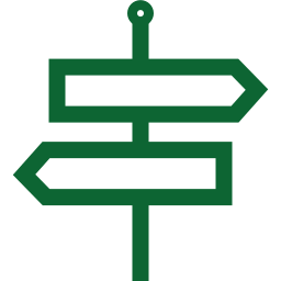 A green sign with two arrows pointing in opposite directions.