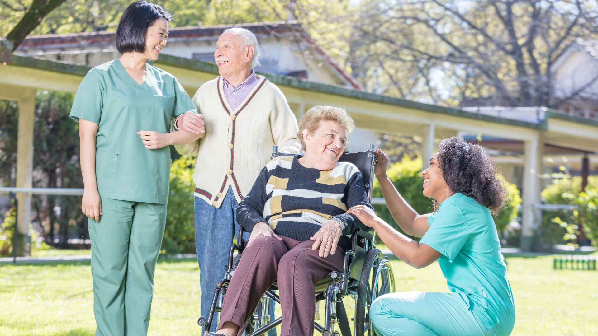 A group of nurses are helping an elderly woman in a wheelchair.