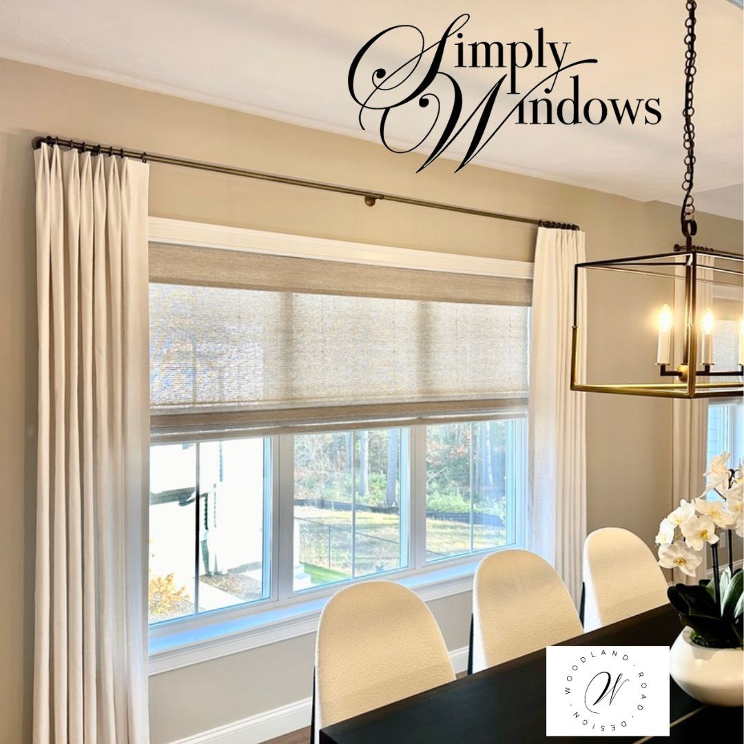 An elegant dining room has layered window treatments in cream and beige- simply windows, ma