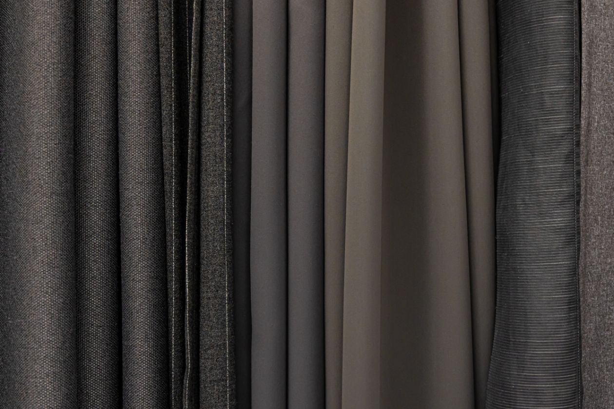 Several dark fabics hang together- Simply-Windows