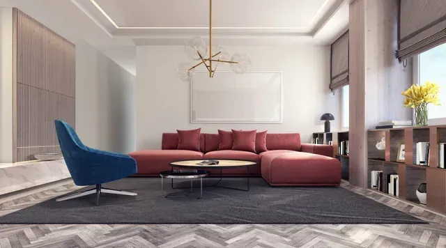 Modern living room with burgundy sectional sofa, blue chair, and neutral tones.