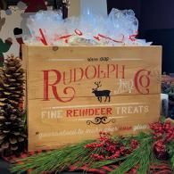 Rustic Rudolph gift box of Fine Reindeer Treats with pine branches and holiday decor