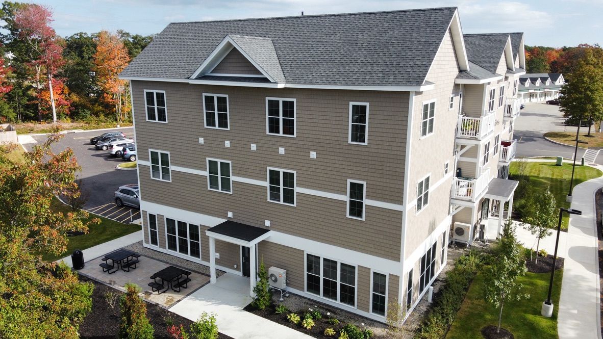 an aerial view of a large apartment building with a lot of windows .