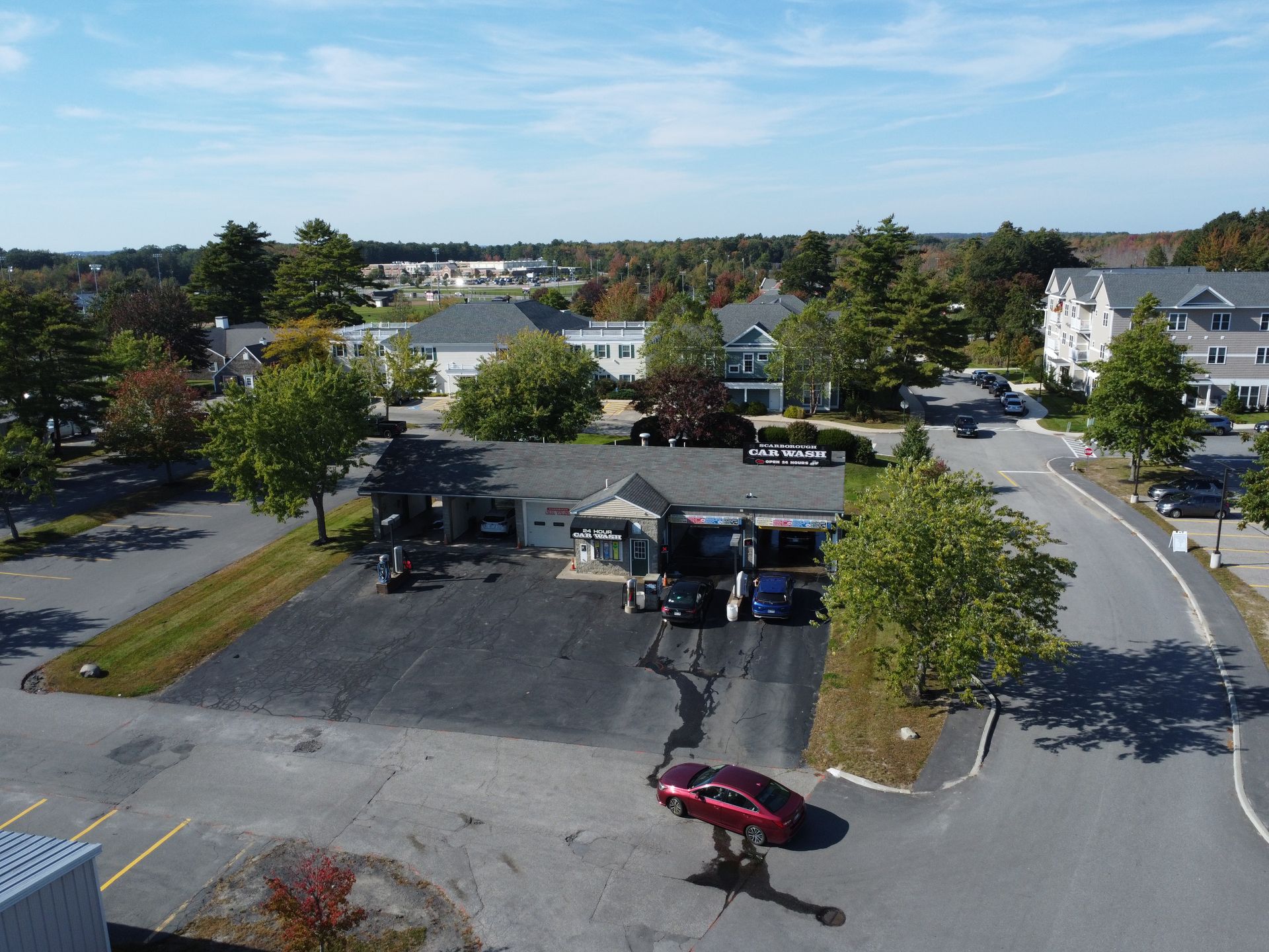 an aerial view of a car wash in a small town