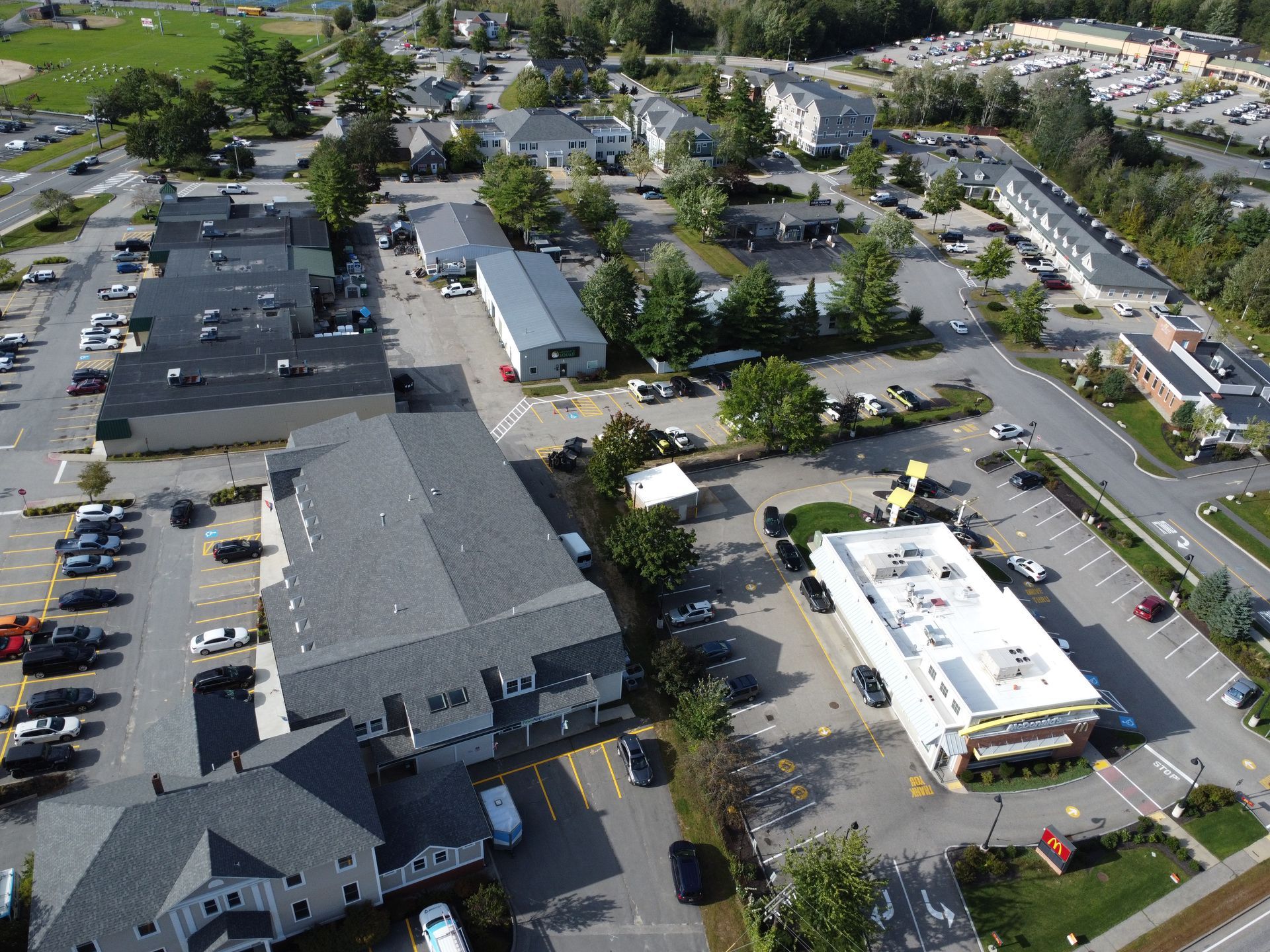 an aerial view of a fast food restaurant in a small town