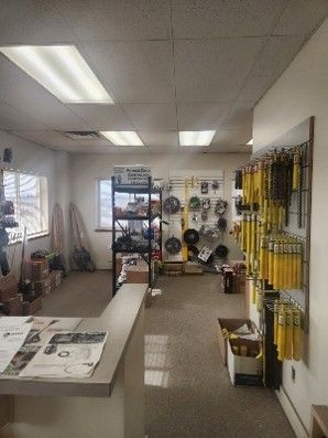 hardware store interior showing organized construction tools and equipment for sale. hardware store interior showing organized construction tools and equipment for sale.