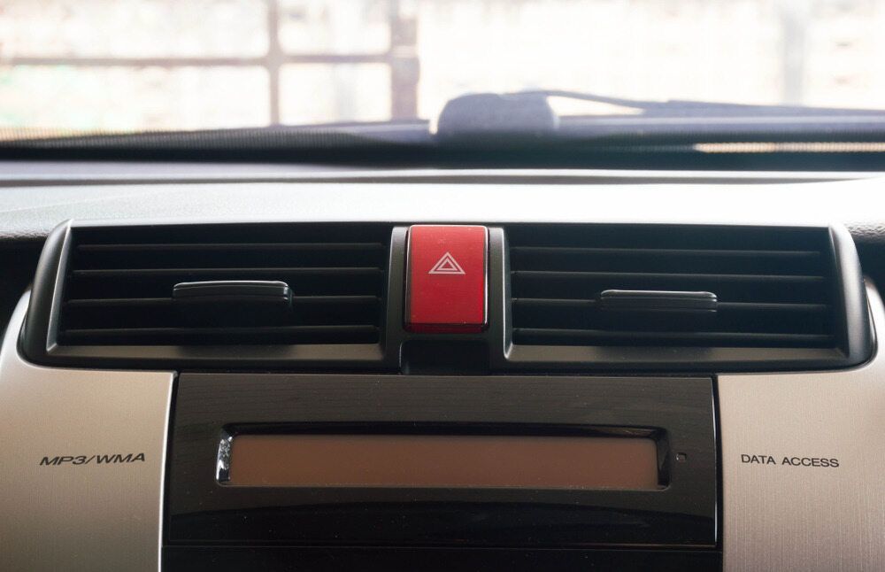 A Close Up of a Car Air Vent With a Red Triangle on It — A Plus Automotive Electrical n Wodonga, NSW
